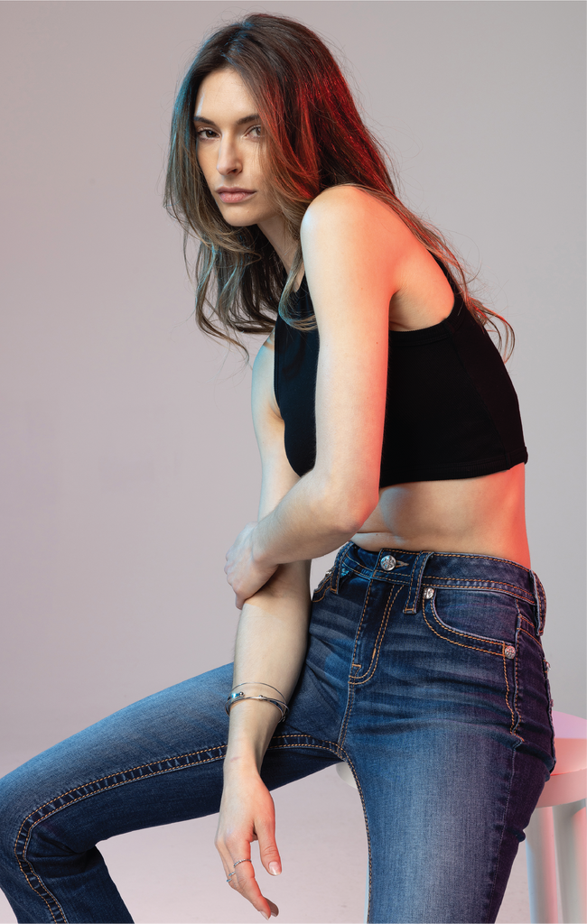 female model in teal denim straight jeans
