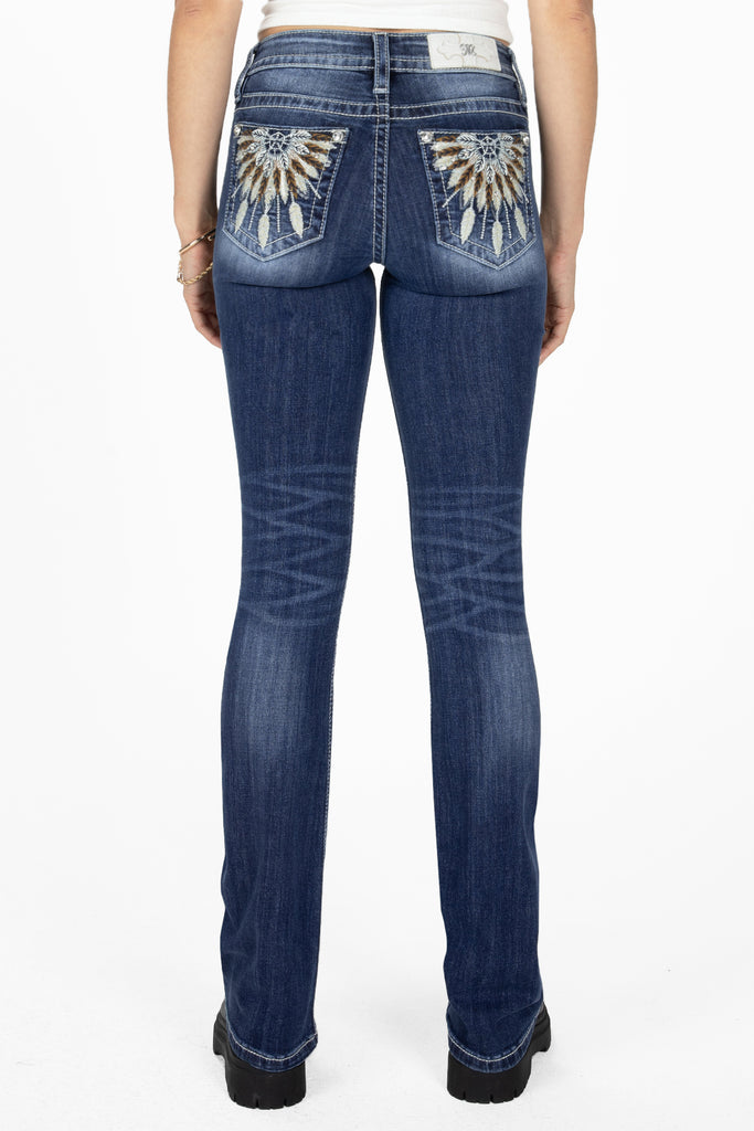 feather dreamcatcher on bootcut jeans back pockets