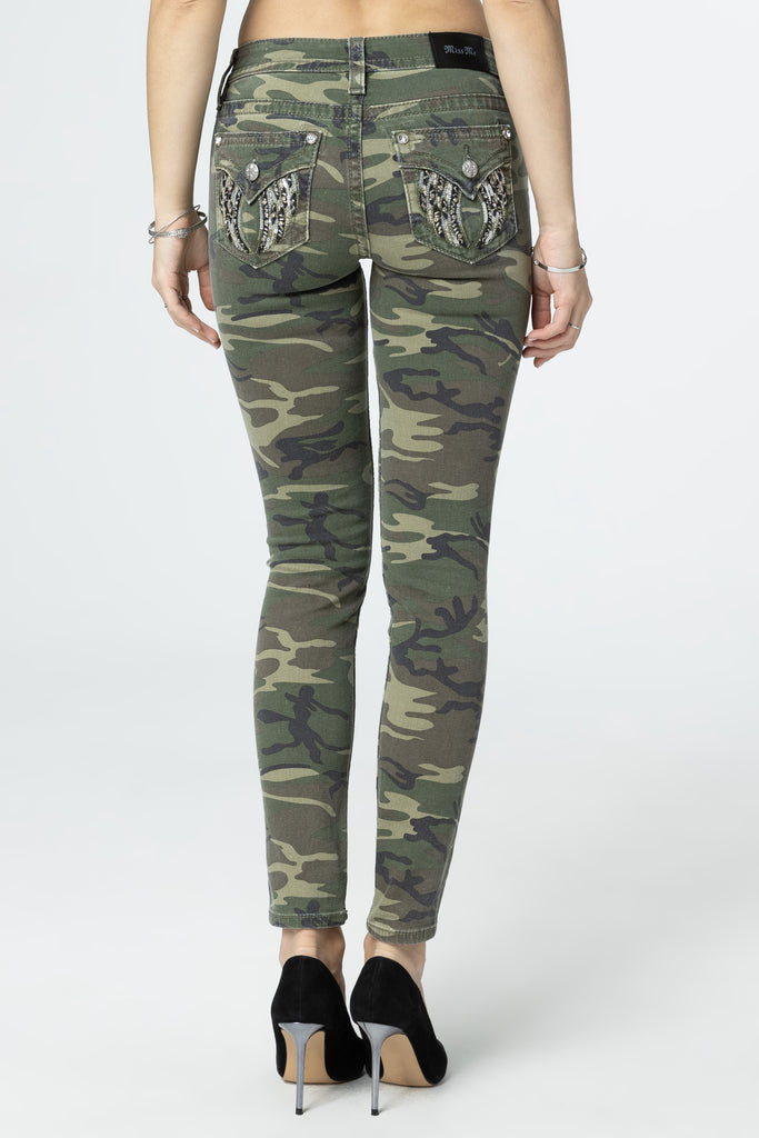 female modeling camo wings skinny jeans