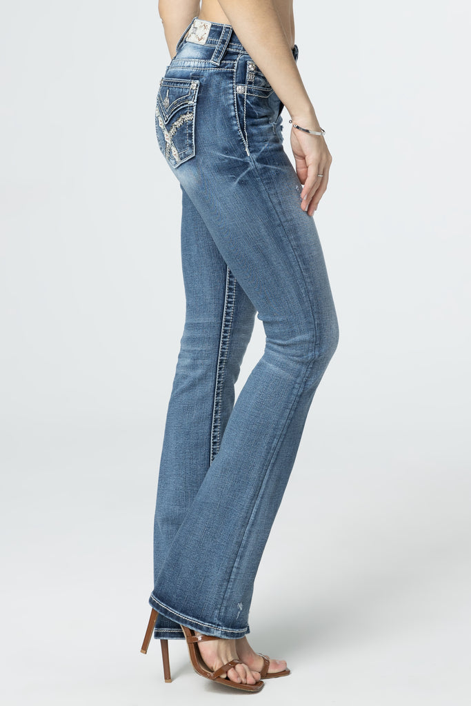side profile of woven cross stitch bootcut jeans