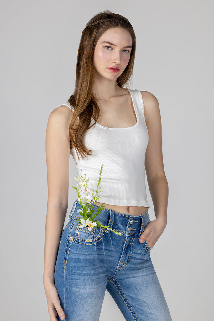 female modeling a white basic knit tank top
